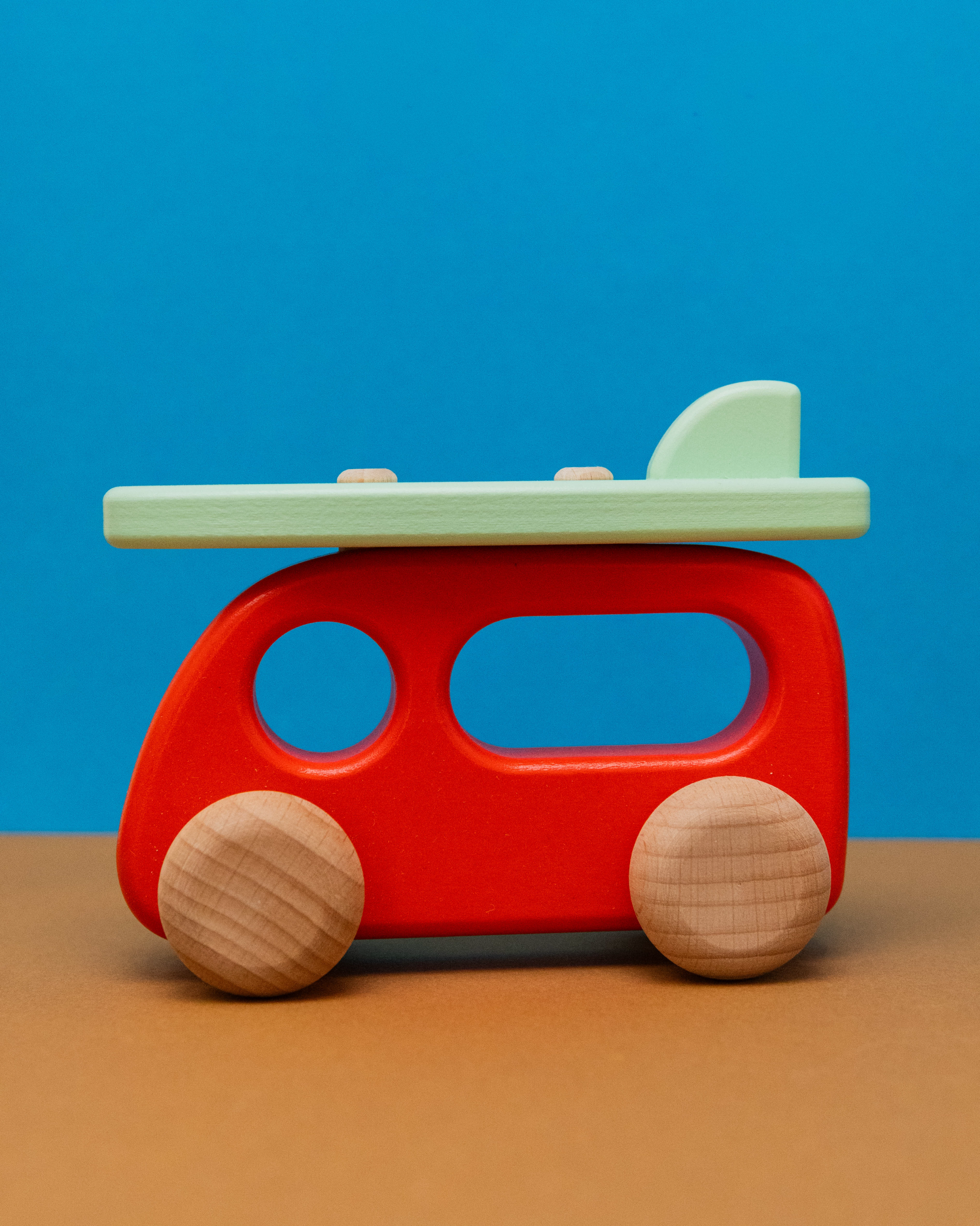 Wooden Camper with Surfboard